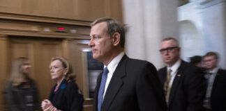 Chief Justice of the United States John Roberts departs the Senate following opening arguments by the Republicans in the impeachment trial of President Donald Trump on charges of abuse of power and obstruction of Congress, at the Capitol in Washington, Saturday, Jan. 25, 2020. 