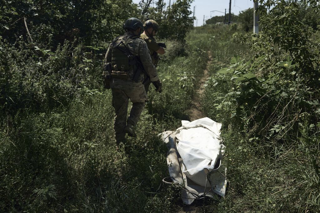 Ukrainian soldiers walk on the frontline near Bakhmut, Donetsk region, Ukraine, Tuesday, July 4 2023. 