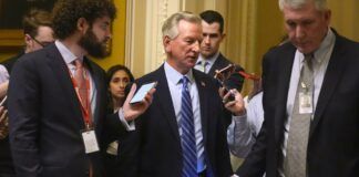 Sen. Tommy Tuberville, R-Ala., speaks with members of the media as he walks, Wednesday, Feb. 28, 2024, at the Capitol in Washington. Earlier Sen. Mitch McConnell announced that he'll step down as Senate Republican leader in November. (AP Photo/Mark Schiefelbein)