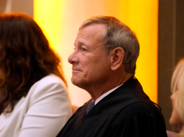 Chief Justice of the United States John Roberts listens as first lady Jill Biden speaks at the National Archivist swearing-in ceremony at the National Archives on Sept. 11, 2023, in Washington. 