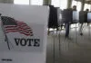 FILE - In this March 18, 2014 file photo, voters cast their ballots in Hinsdale, Ill. Illinois is set to receive $13.9 million in federal funds after Russian hackers breached the state's voter registration systems ahead of the 2016 election. Illinois plans to use the money to enhance its cybersecurity practices and to train local election officials. Elections officials had initially hoped to use the funds to replace decades-old voting machines. But state and federal requirements say the money must be used primarily on preventing a repeat of 2016.